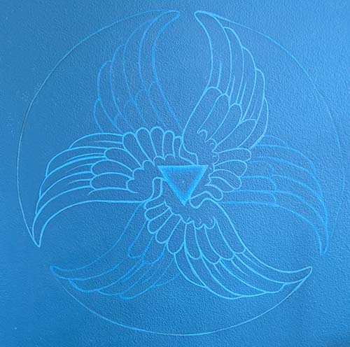 Alexandra Cabri's three winged sacred symbol painted in blue